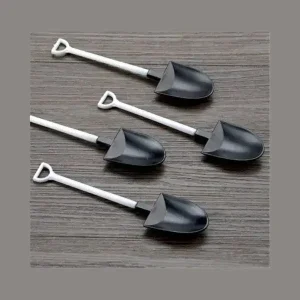Four black shovel spoons 5 inch with white handles arranged for display