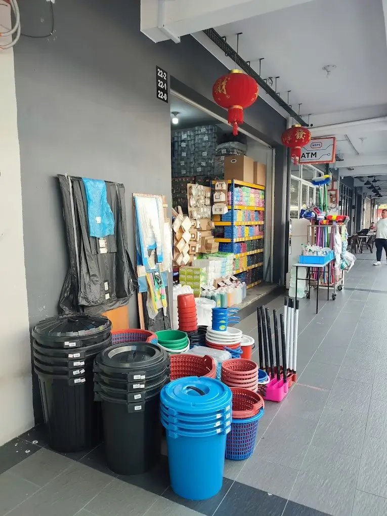 Plastic shop store interior with stacked buckets, containers and various plastic products along retail walkway